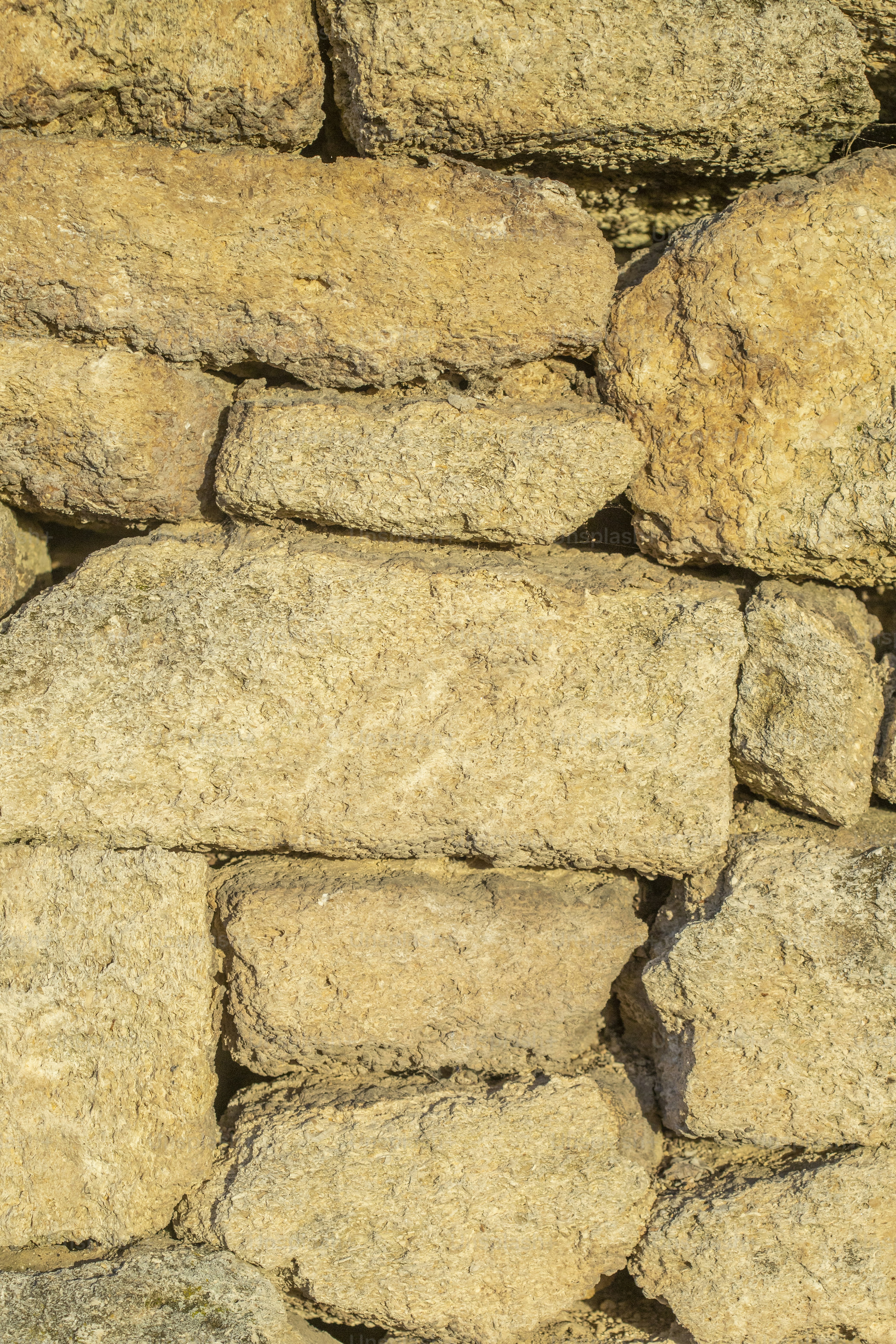 A close up of a stone wall made of rocks photo – Wall Image on Unsplash