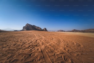 a dirt road in the middle of a desert