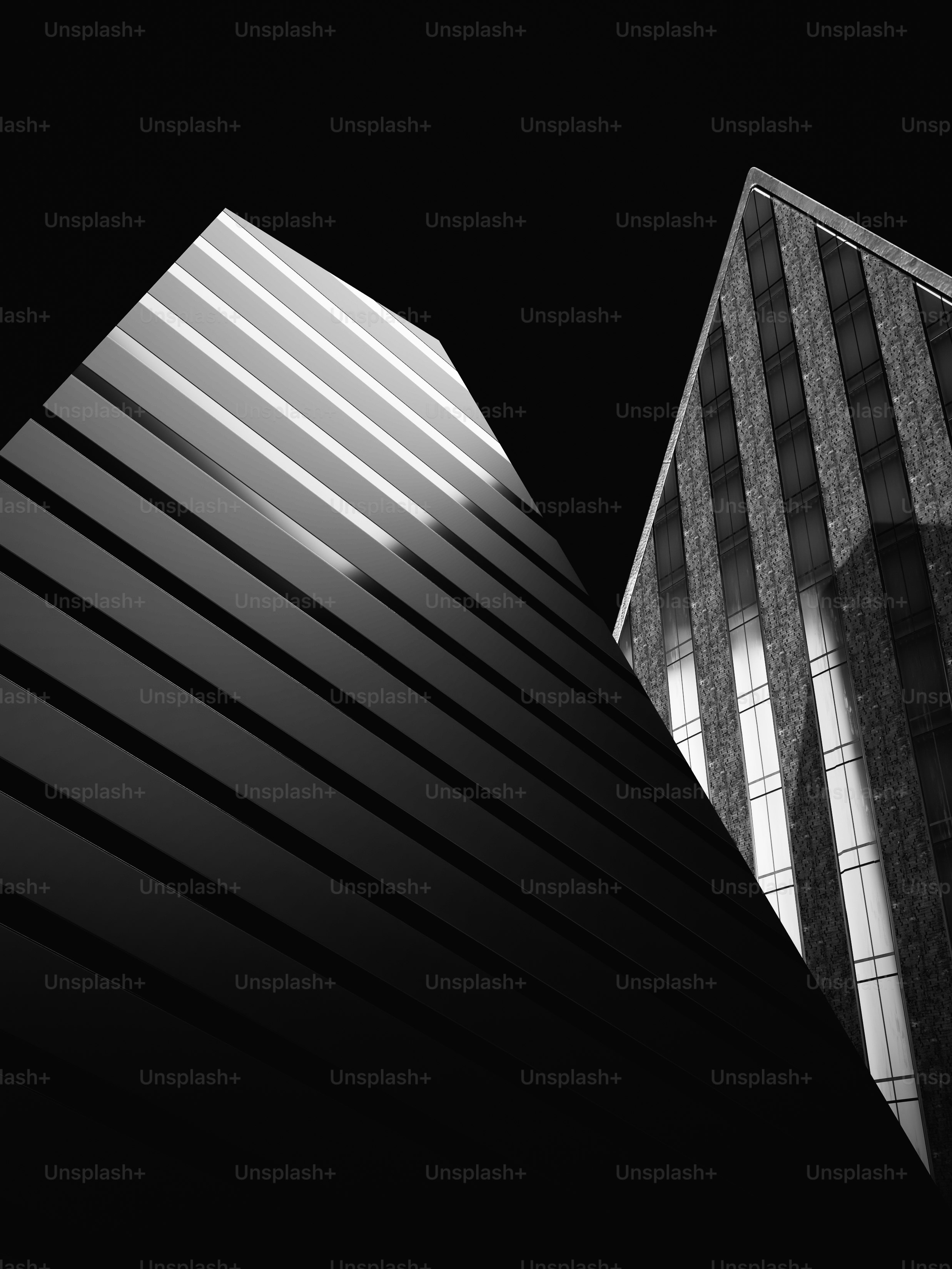 a black and white photo of two tall buildings