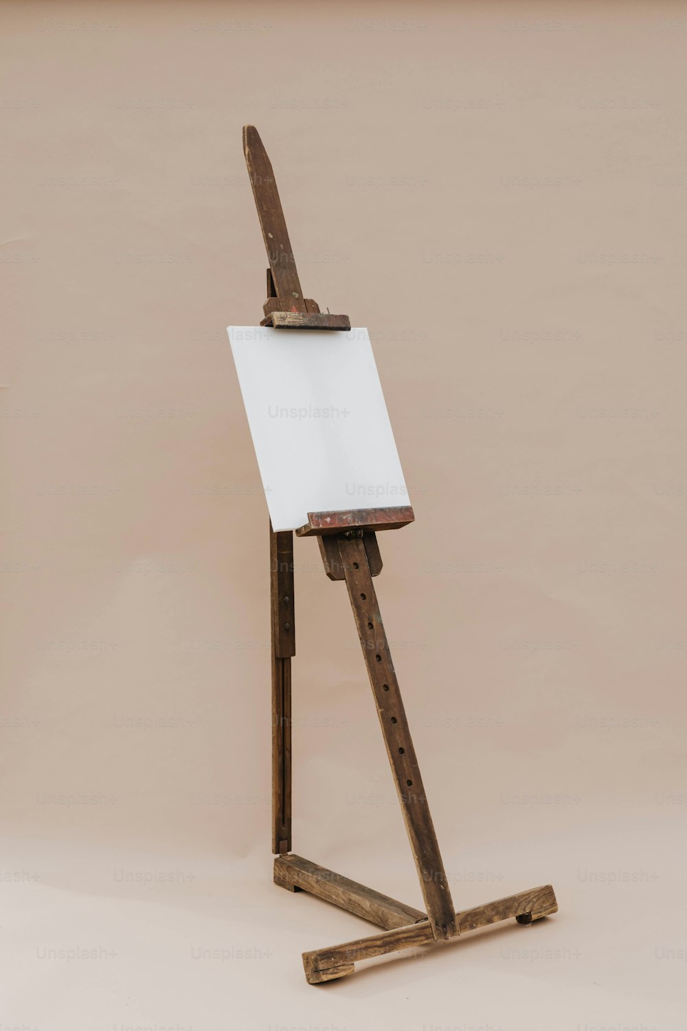 a wooden easel with a white board on it