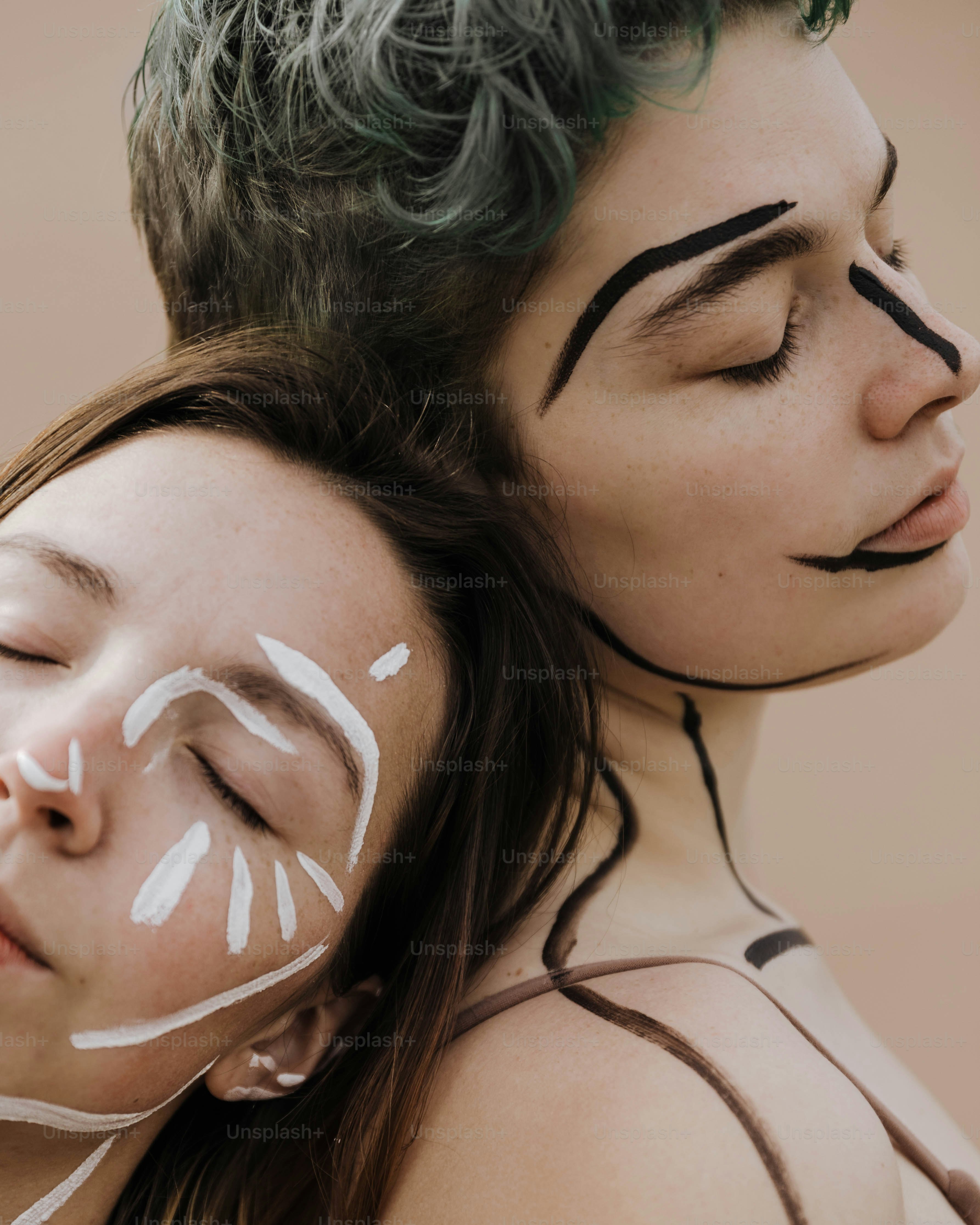 a couple of people with face paint on their faces