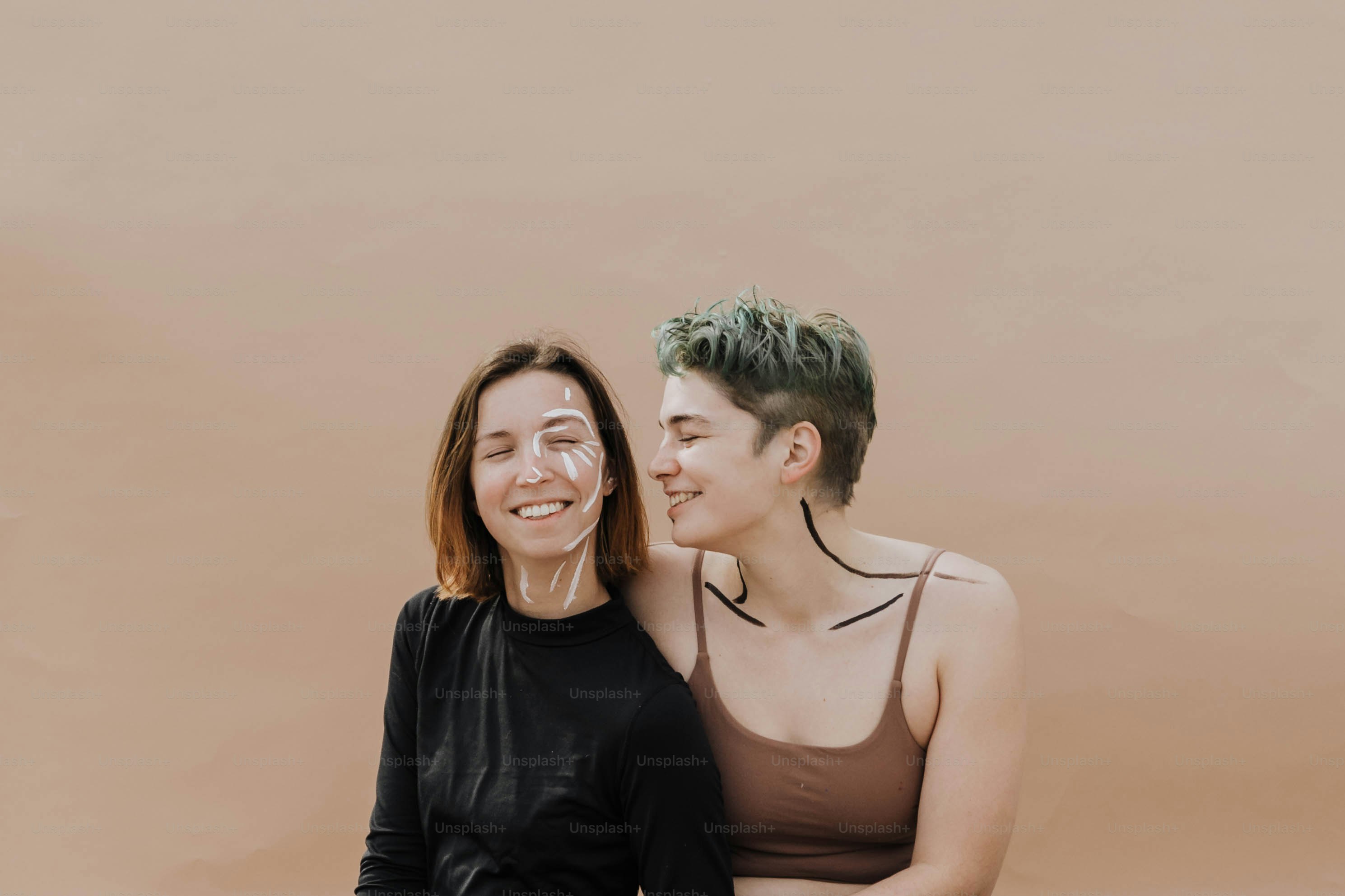 a couple of women sitting next to each other