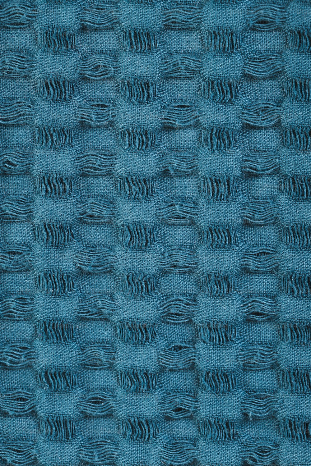 a close up of a blue fabric texture