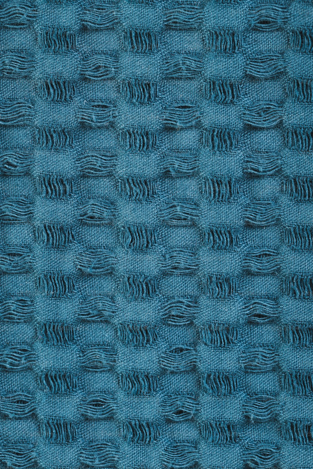um close up de uma textura de tecido azul