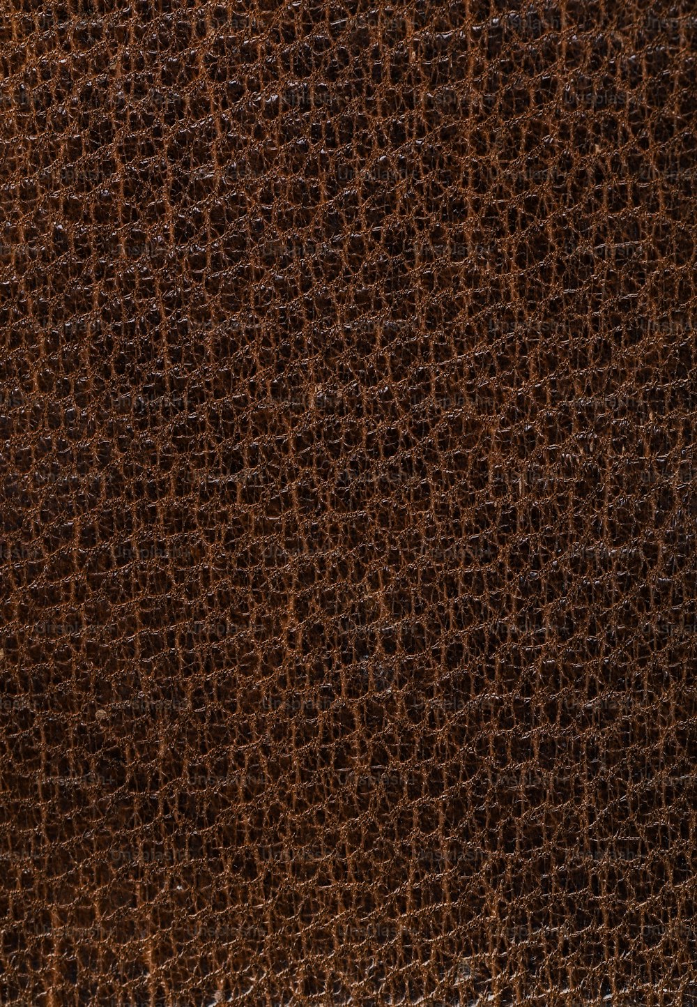 a close up of a brown leather texture