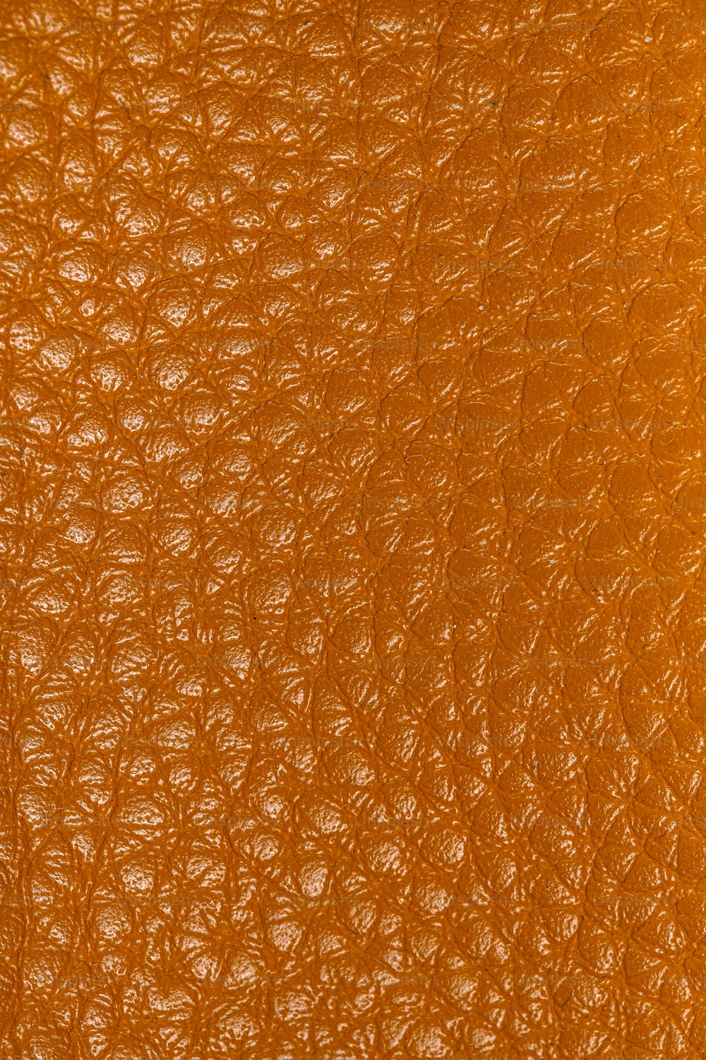 a close up of a brown leather texture