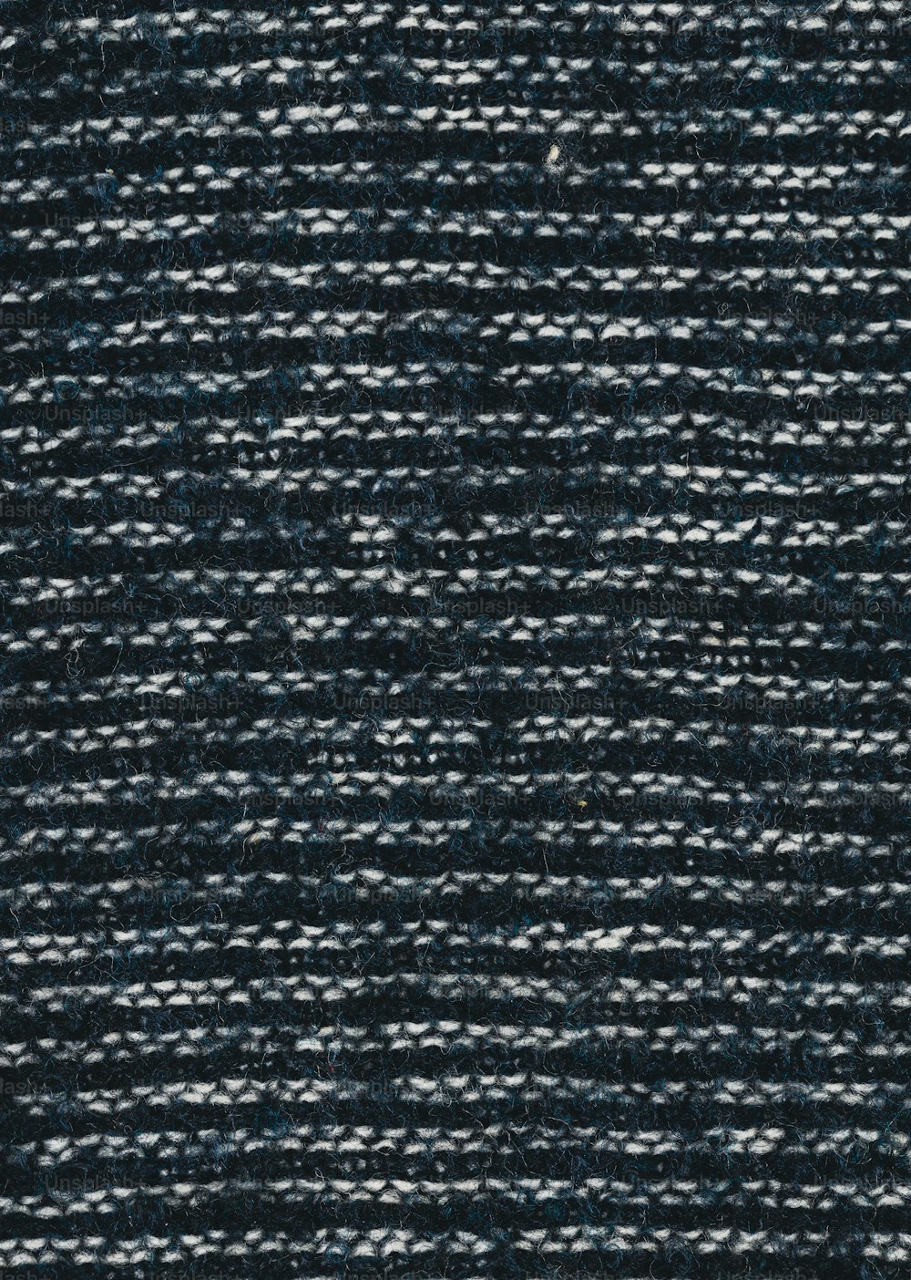 um close up de um tecido texturizado preto e branco