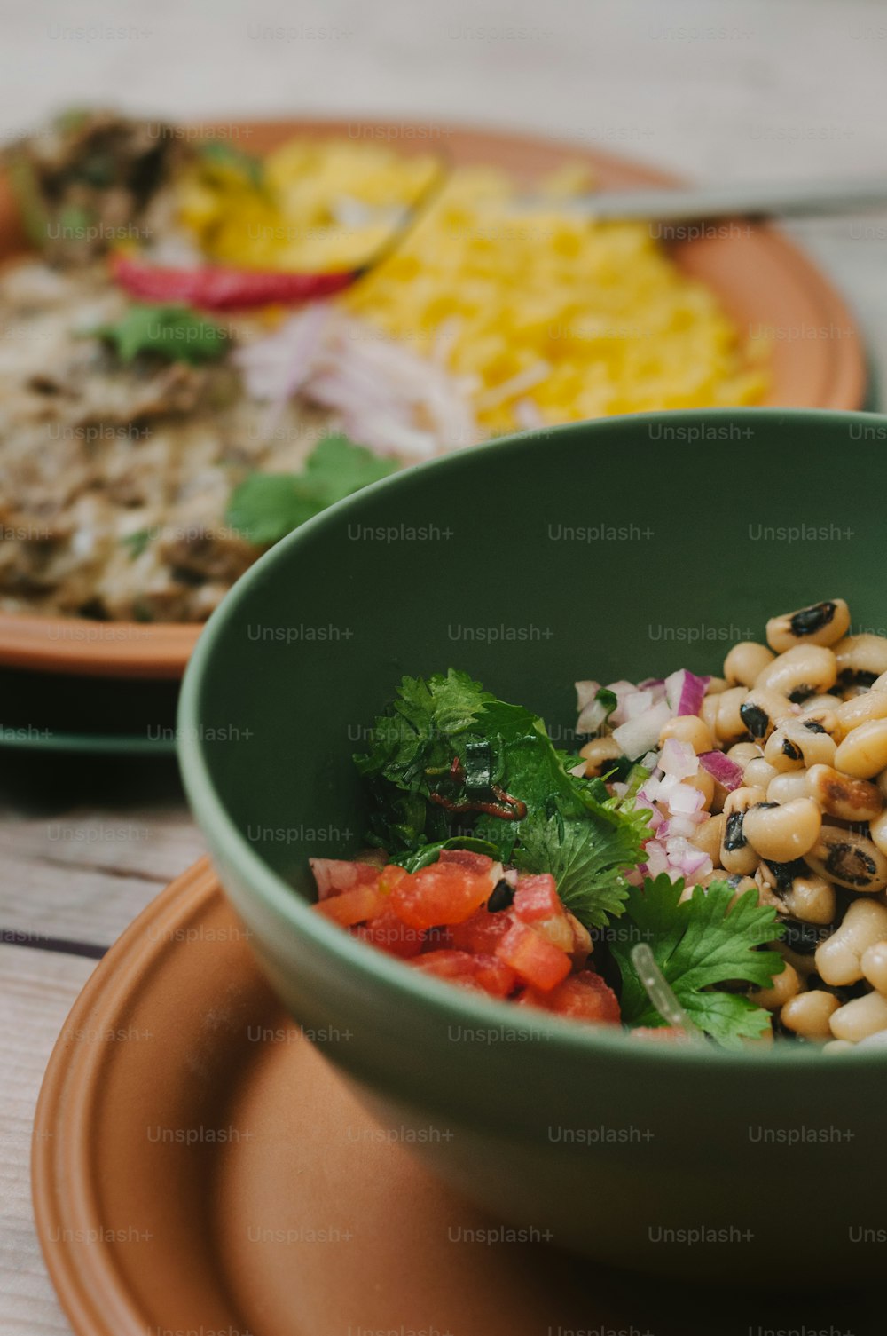 a bowl of food on a plate on a table