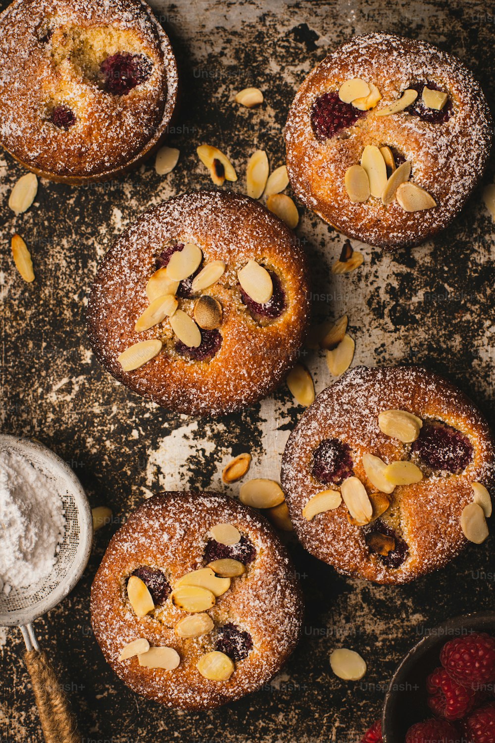 a table topped with pastries covered in powdered sugar