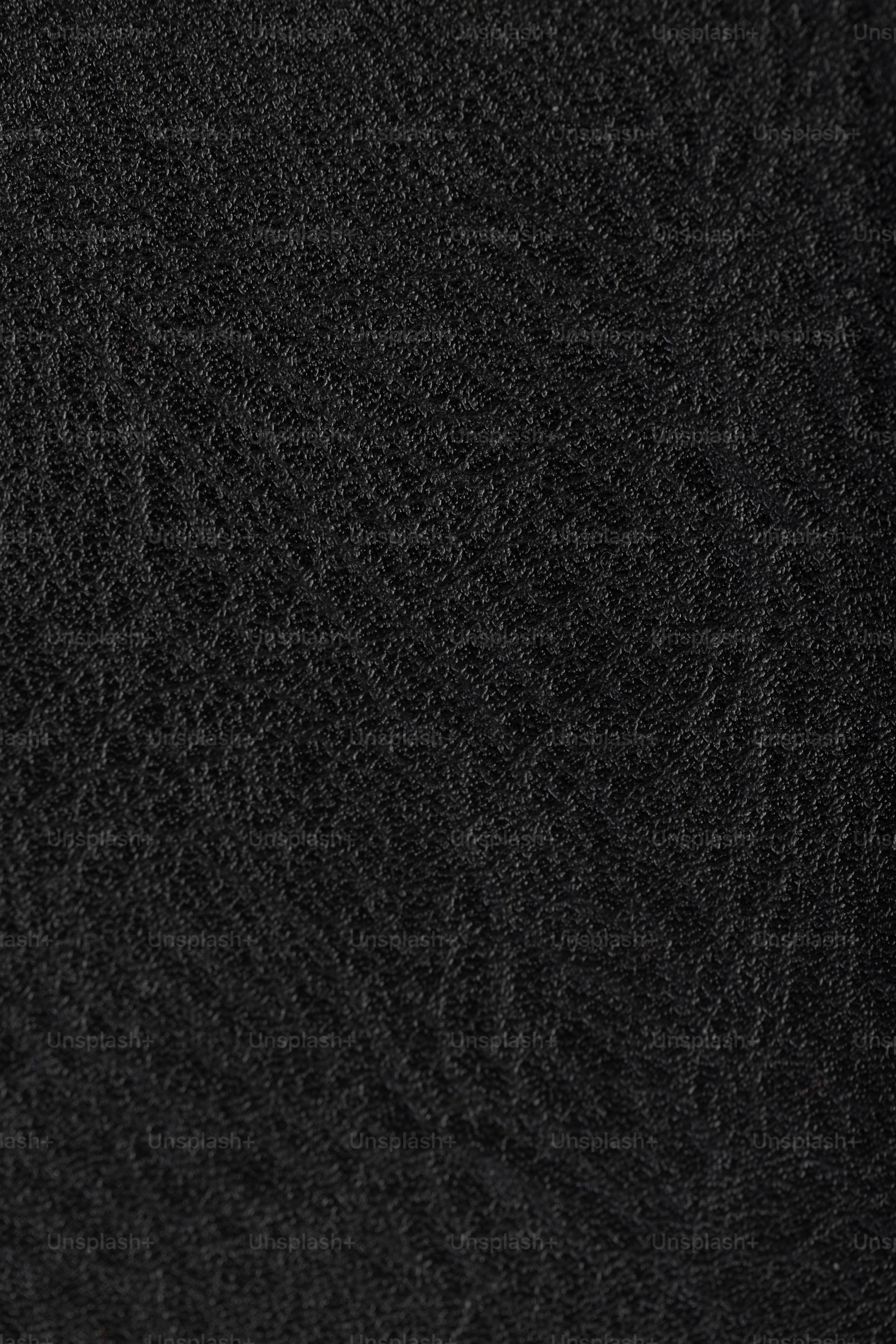 a close up of a black cloth texture