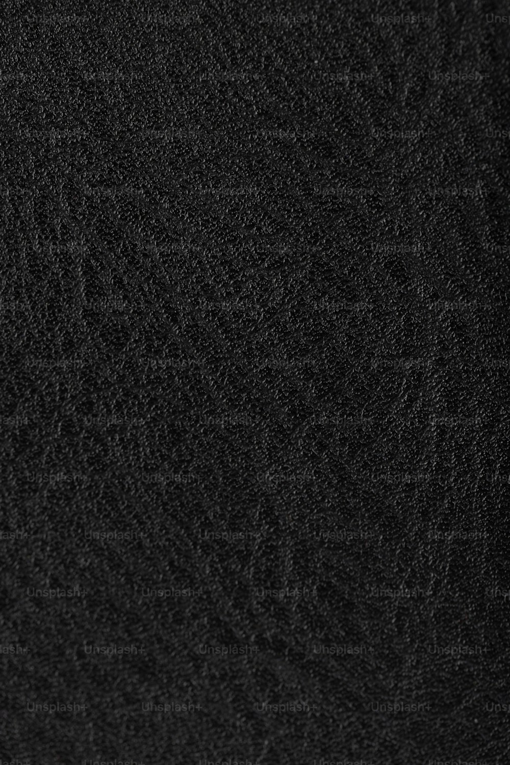 a close up of a black cloth texture