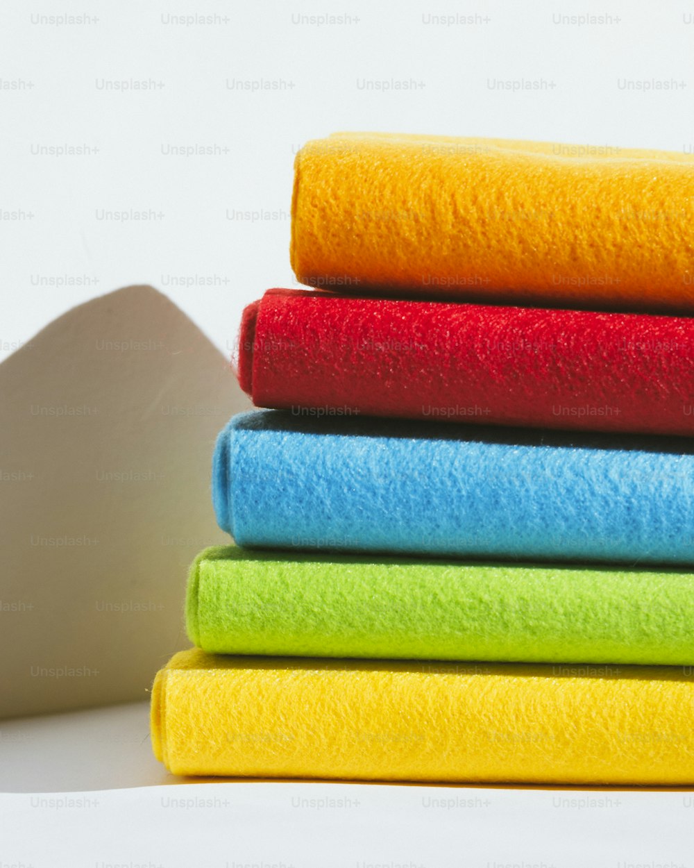 a stack of different colored sponges sitting on top of each other