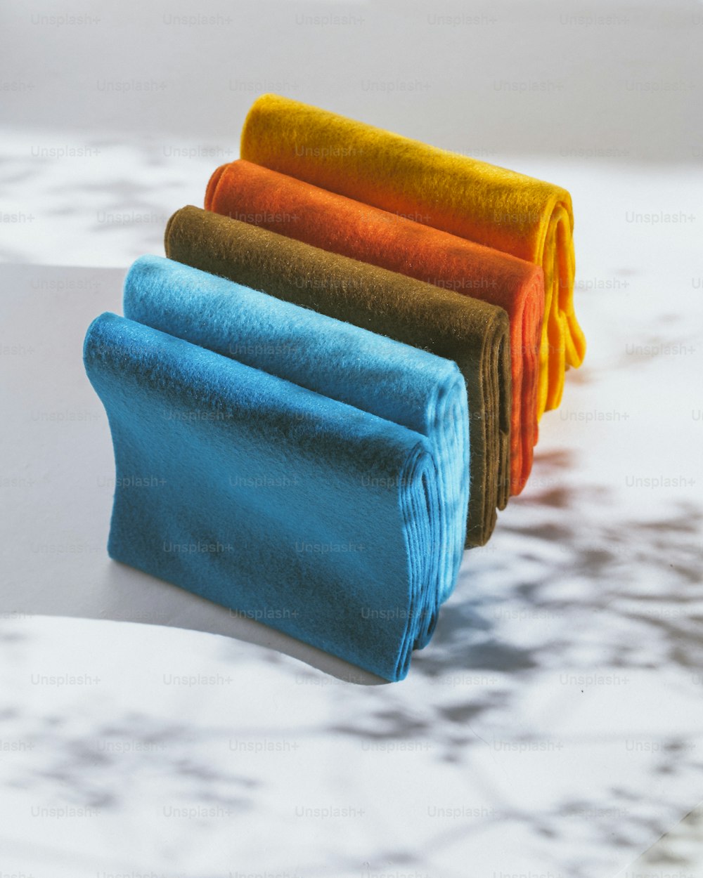 a stack of towels sitting on top of a table