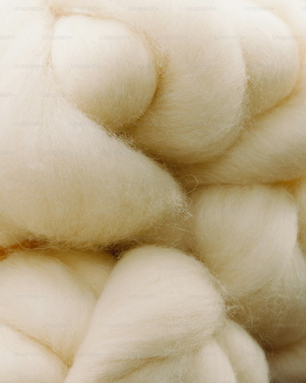 a pile of white wool sitting on top of a table