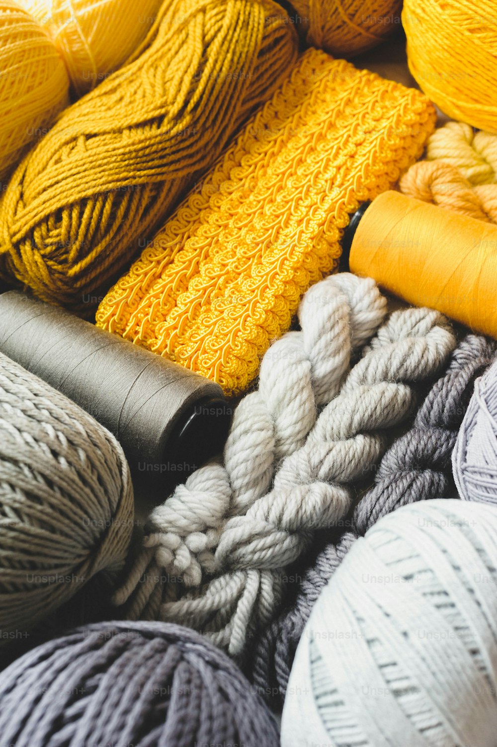 many balls of yarn are sitting on a table