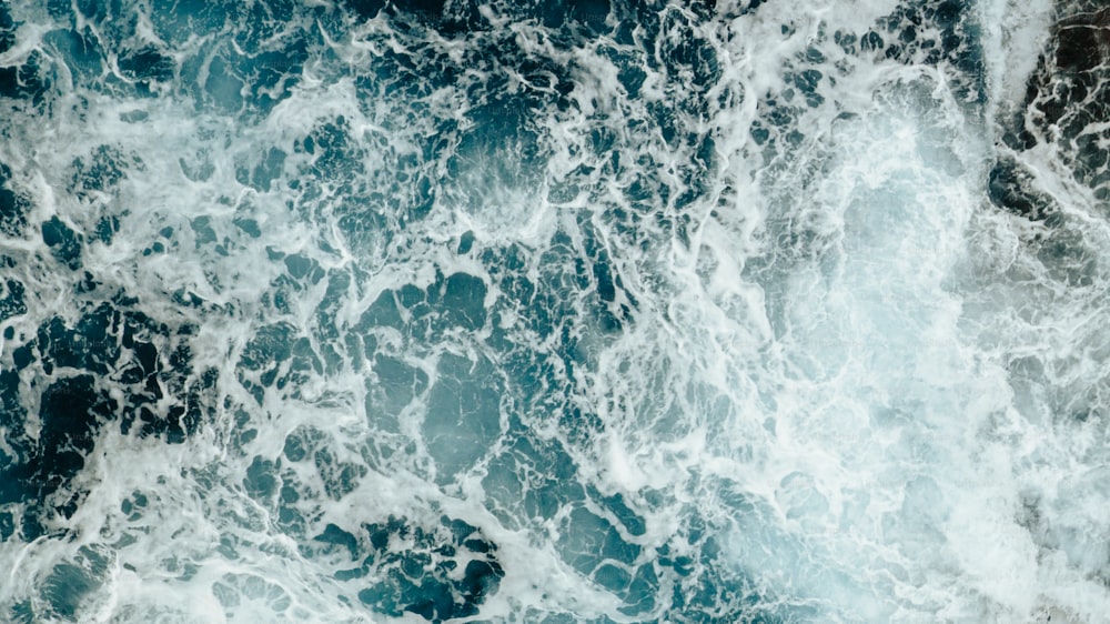 a large body of water covered in lots of white foam