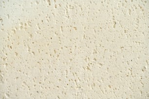a close up of a wall with water drops on it