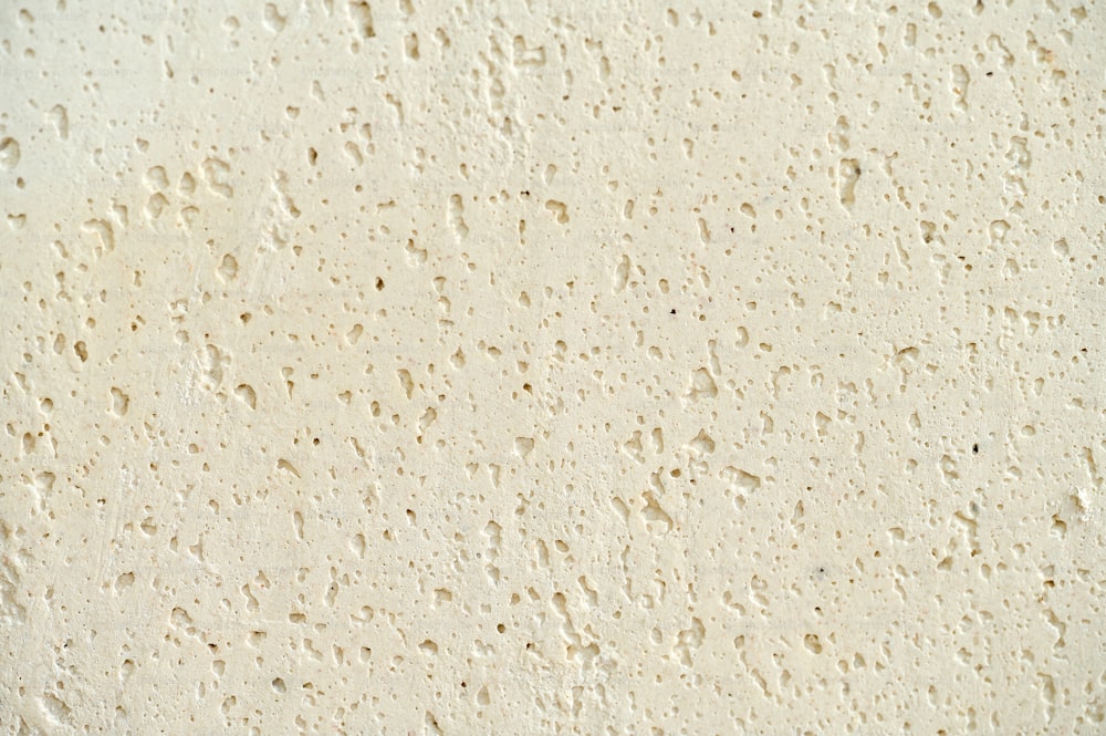 a close up of a wall with water drops on it