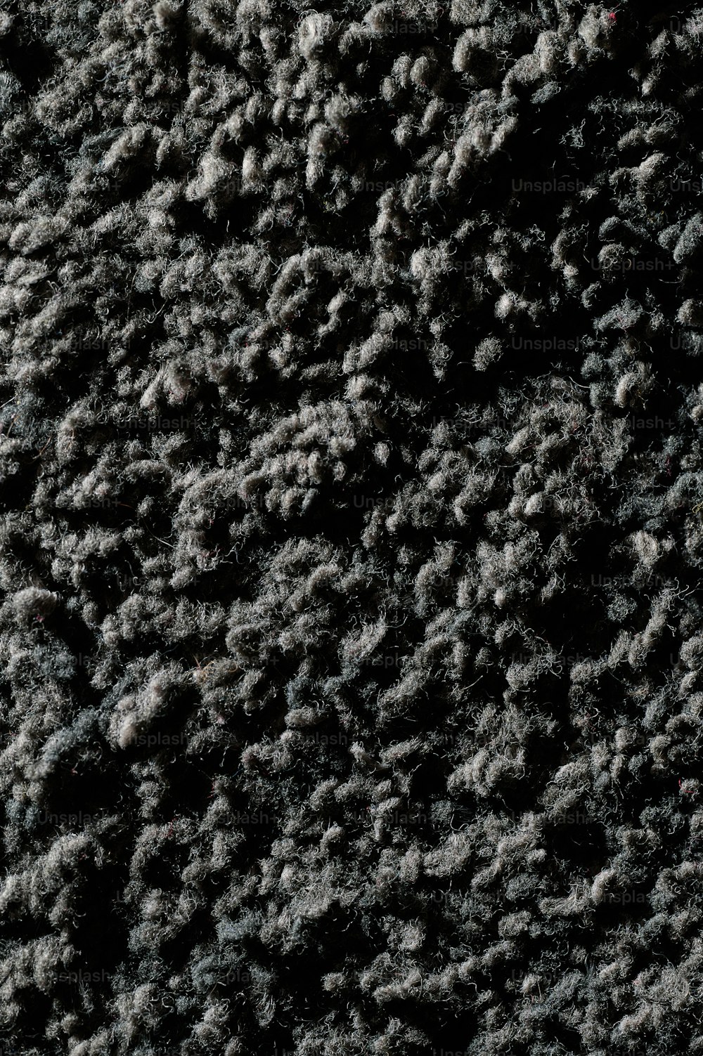 a close up of a black and white carpet