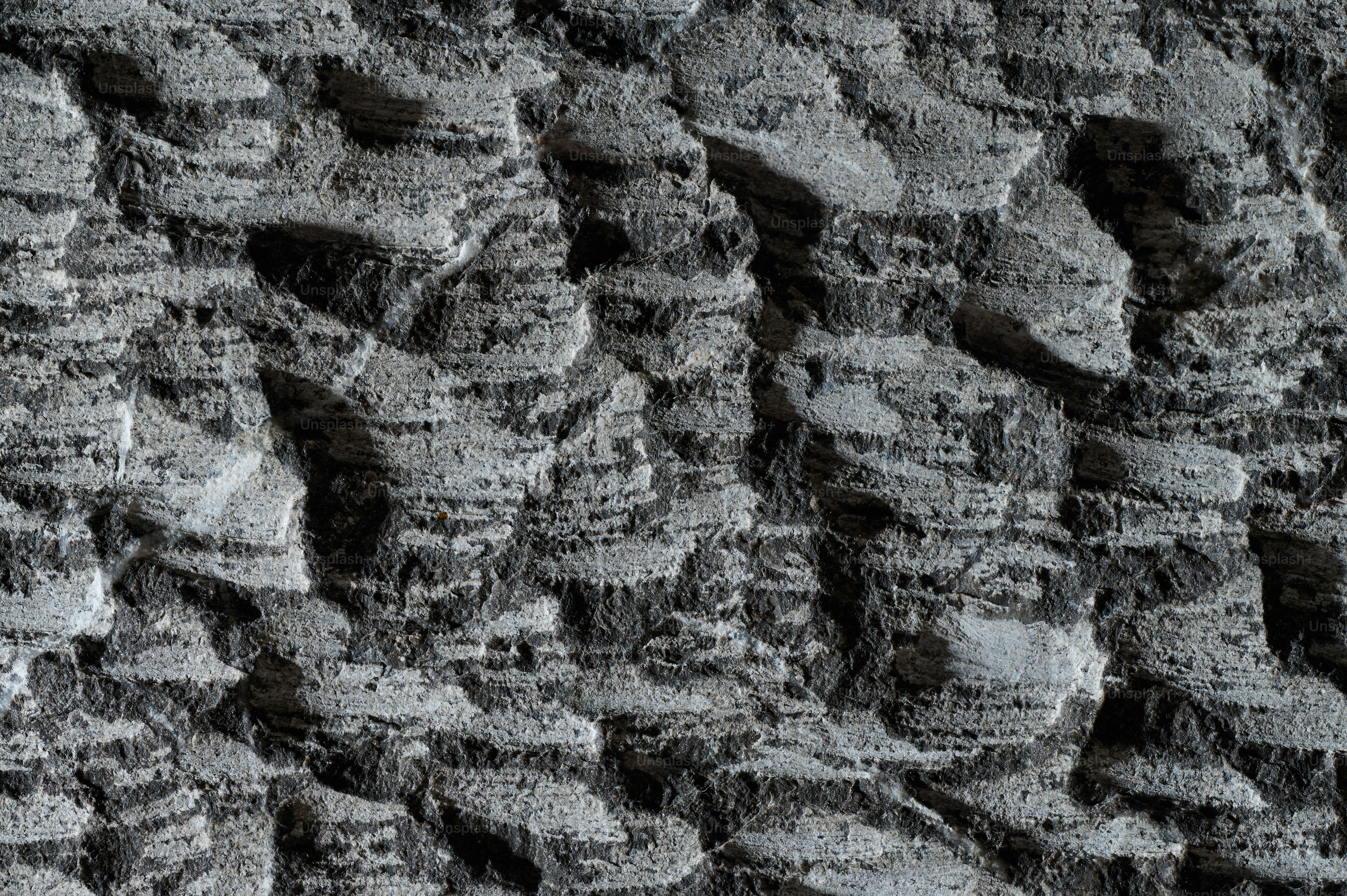 a close up of a wall made of rocks
