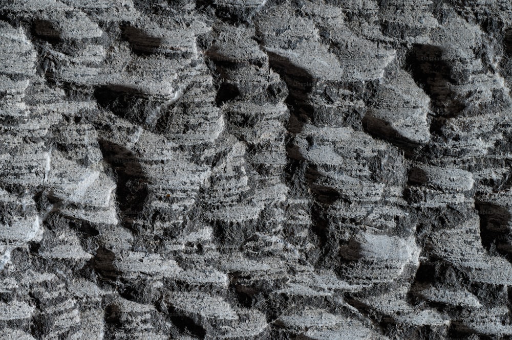 a close up of a wall made of rocks