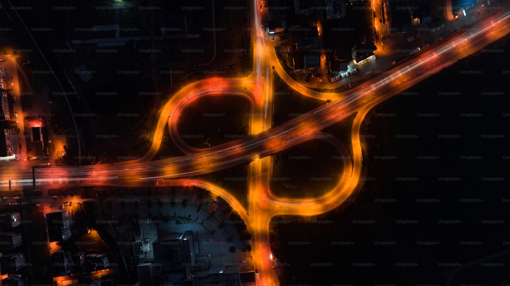 an aerial view of a city intersection at night