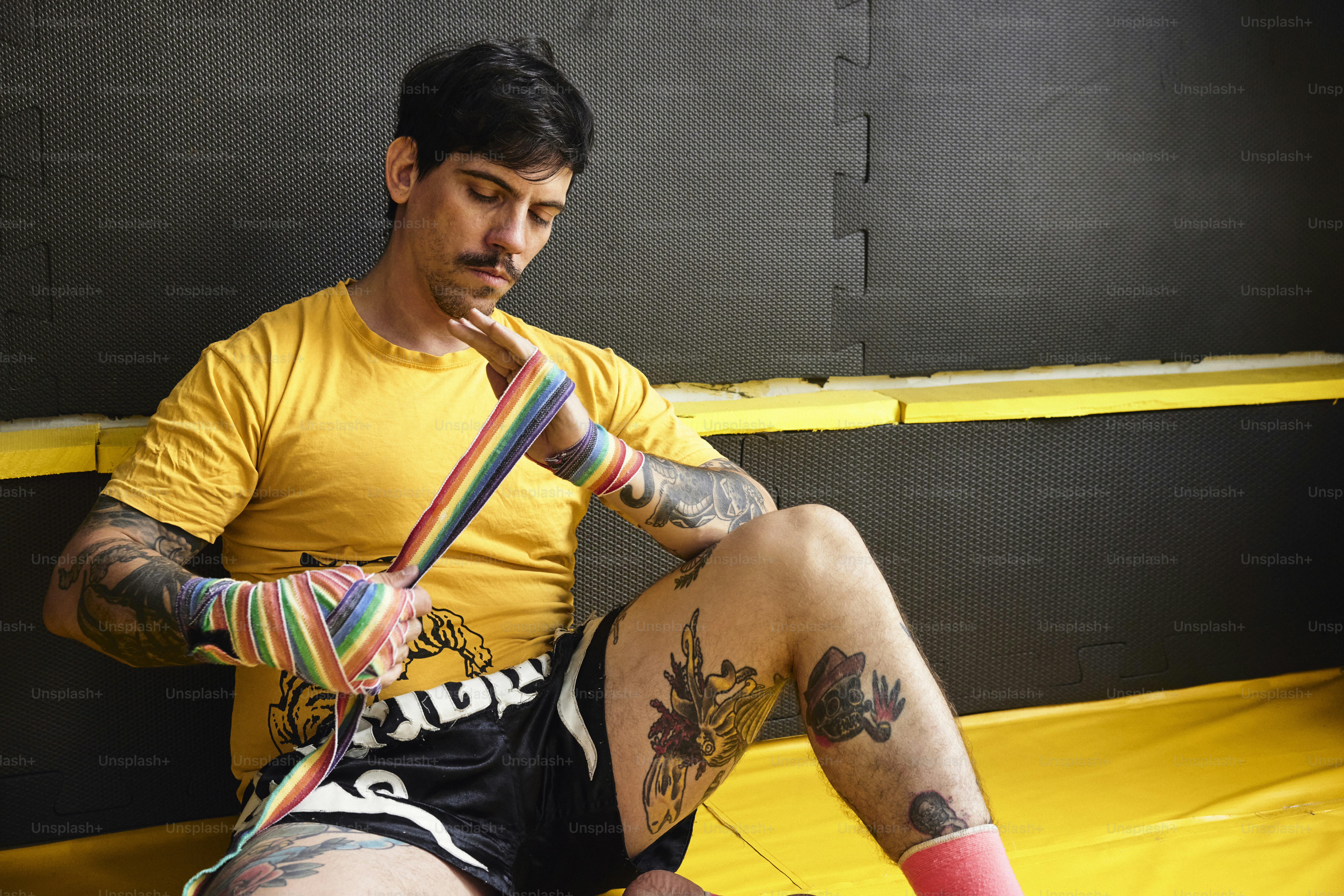 Adult using muscle recovery compression device after exercise session