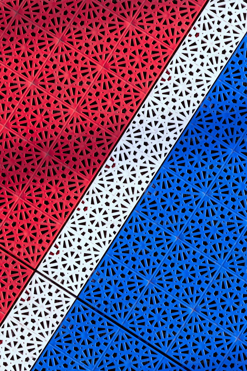a red, white and blue background with a pattern