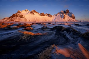 a mountain range with snow on the top of it