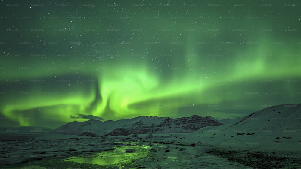 a green and purple sky with a stream of water