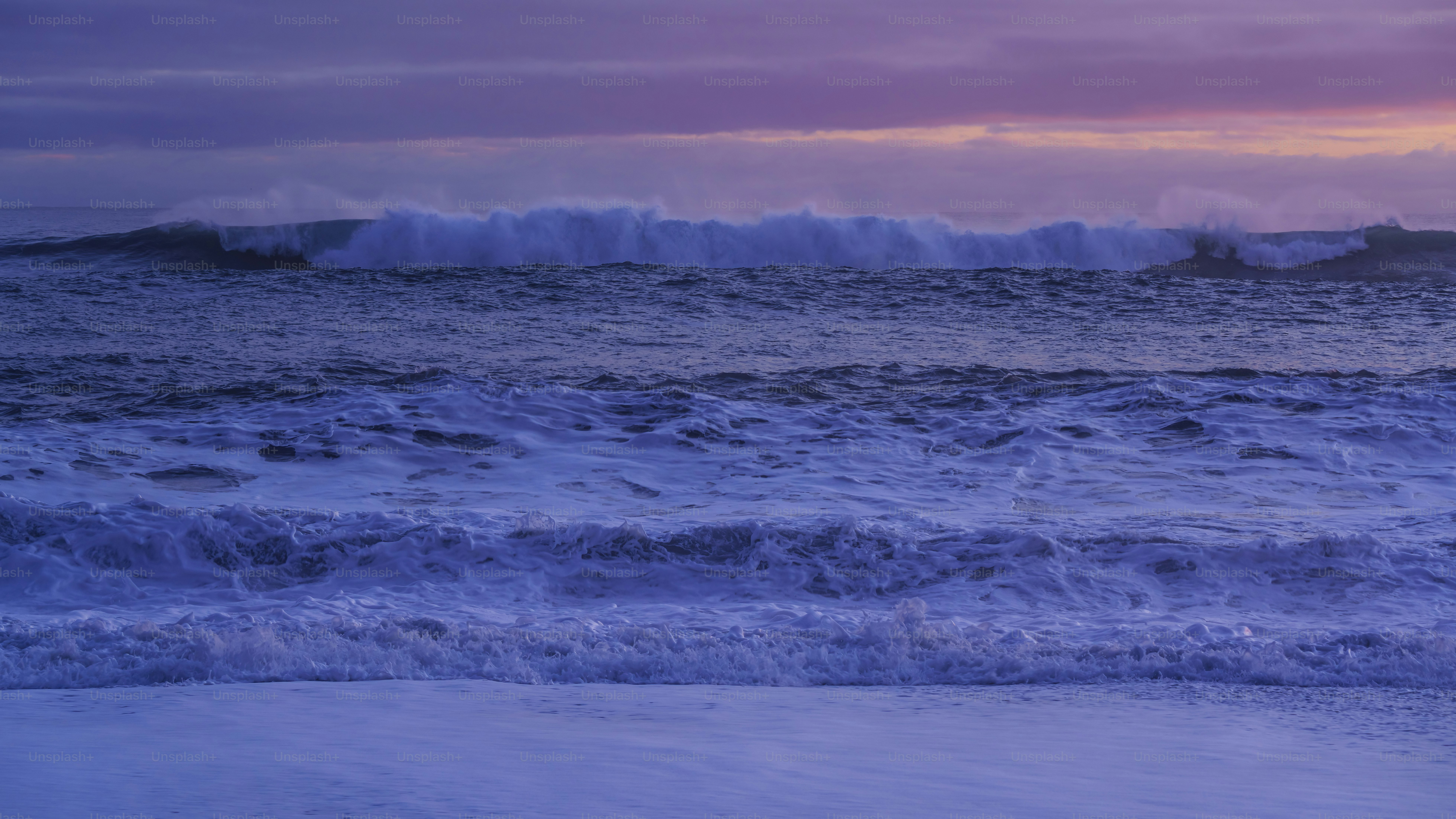 a large body of water with waves coming in