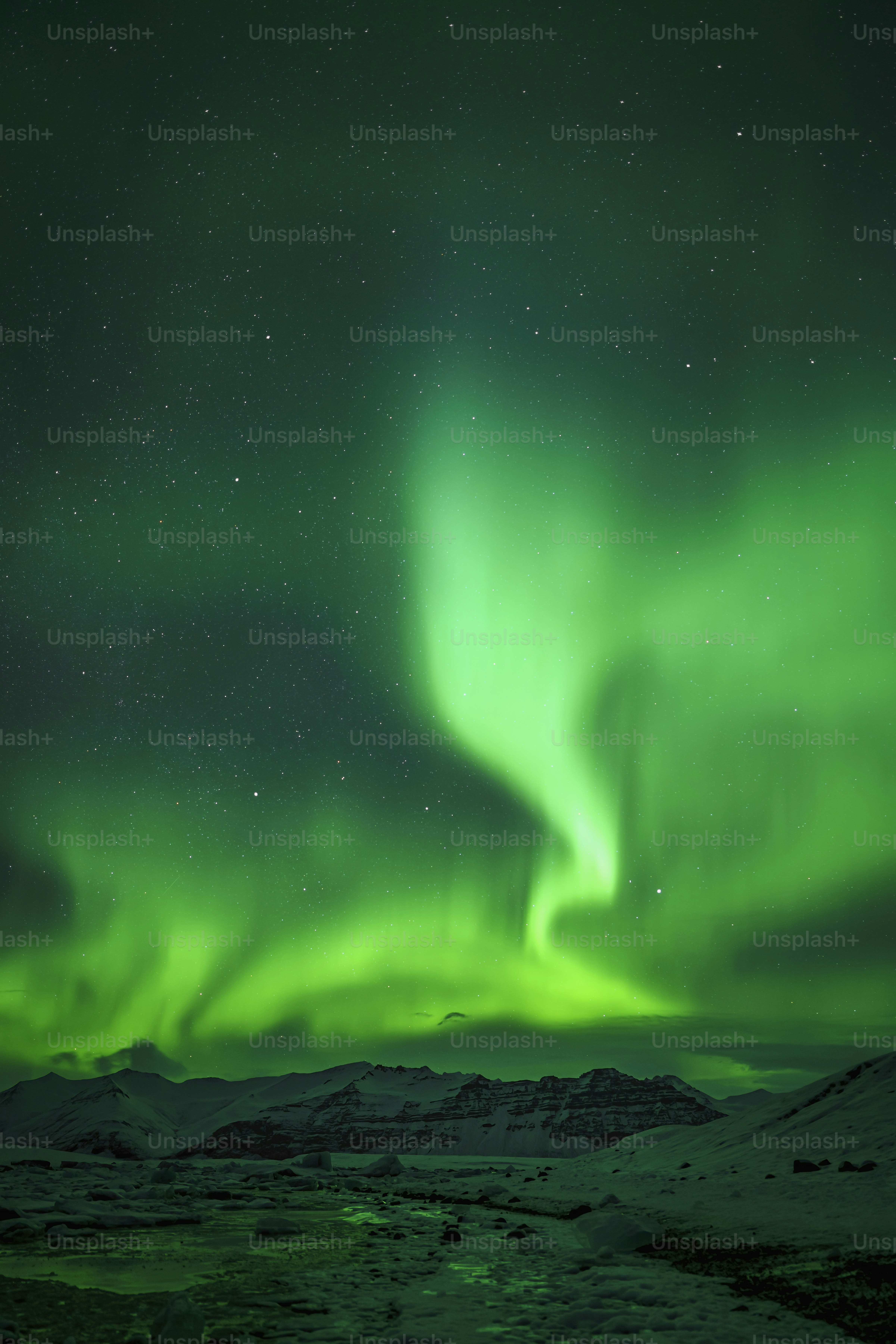 a bright green aurora bore in the night sky