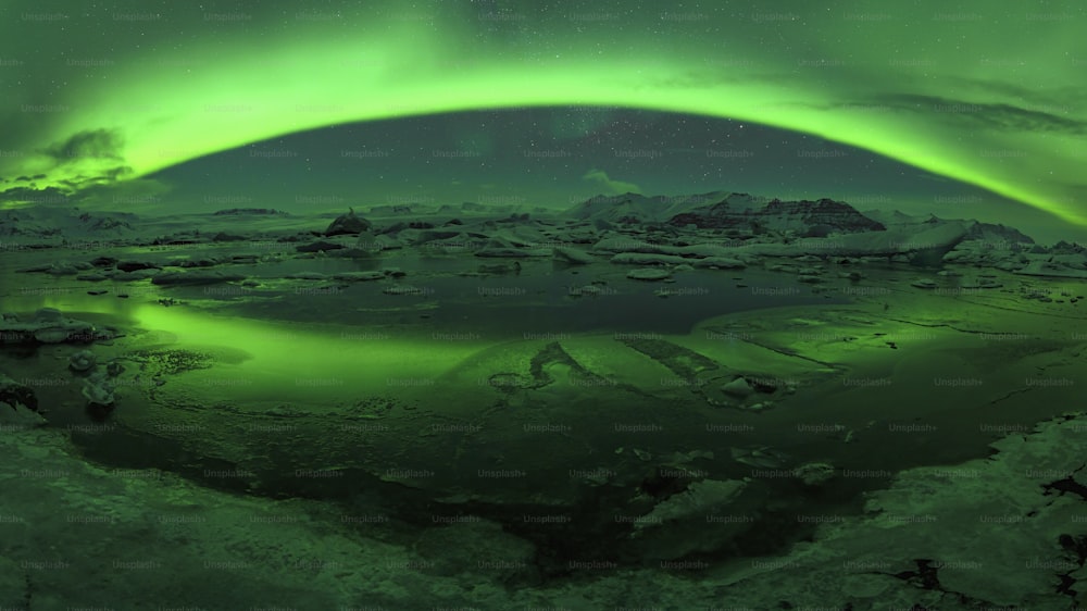 a green aurora bore over a frozen lake