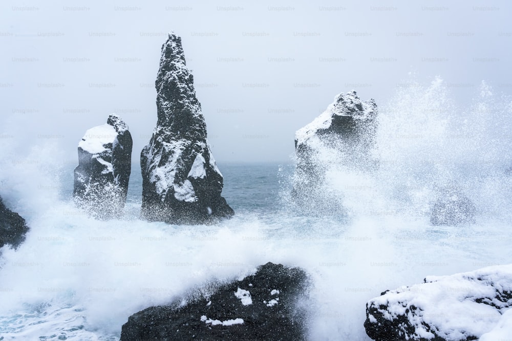 a rock formation in the middle of a body of water