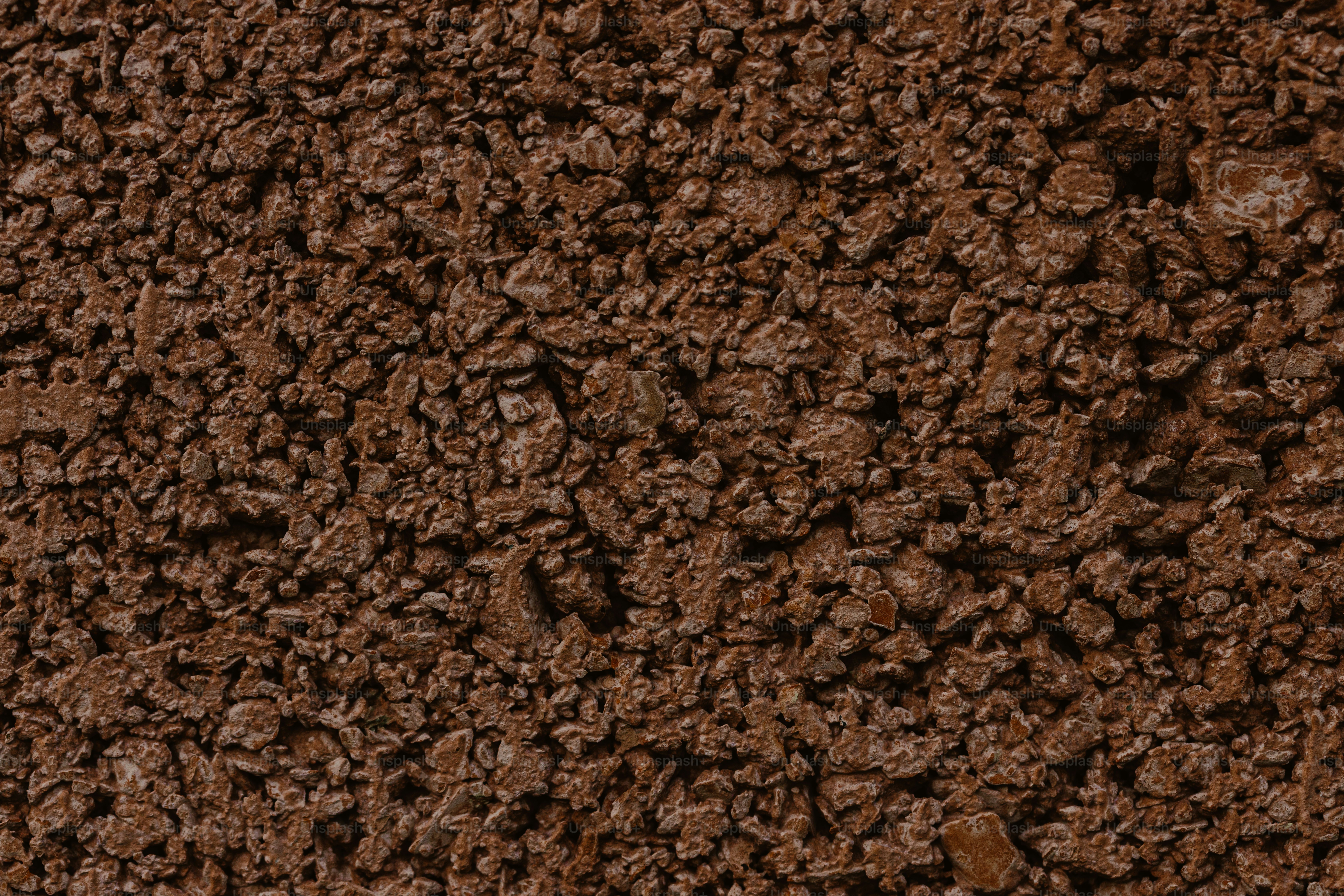 a close up of a brown dirt surface