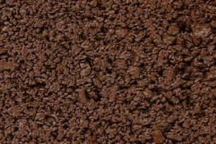 a close up of a brown dirt surface