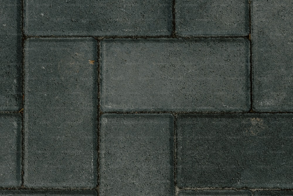 a close up of a gray brick wall