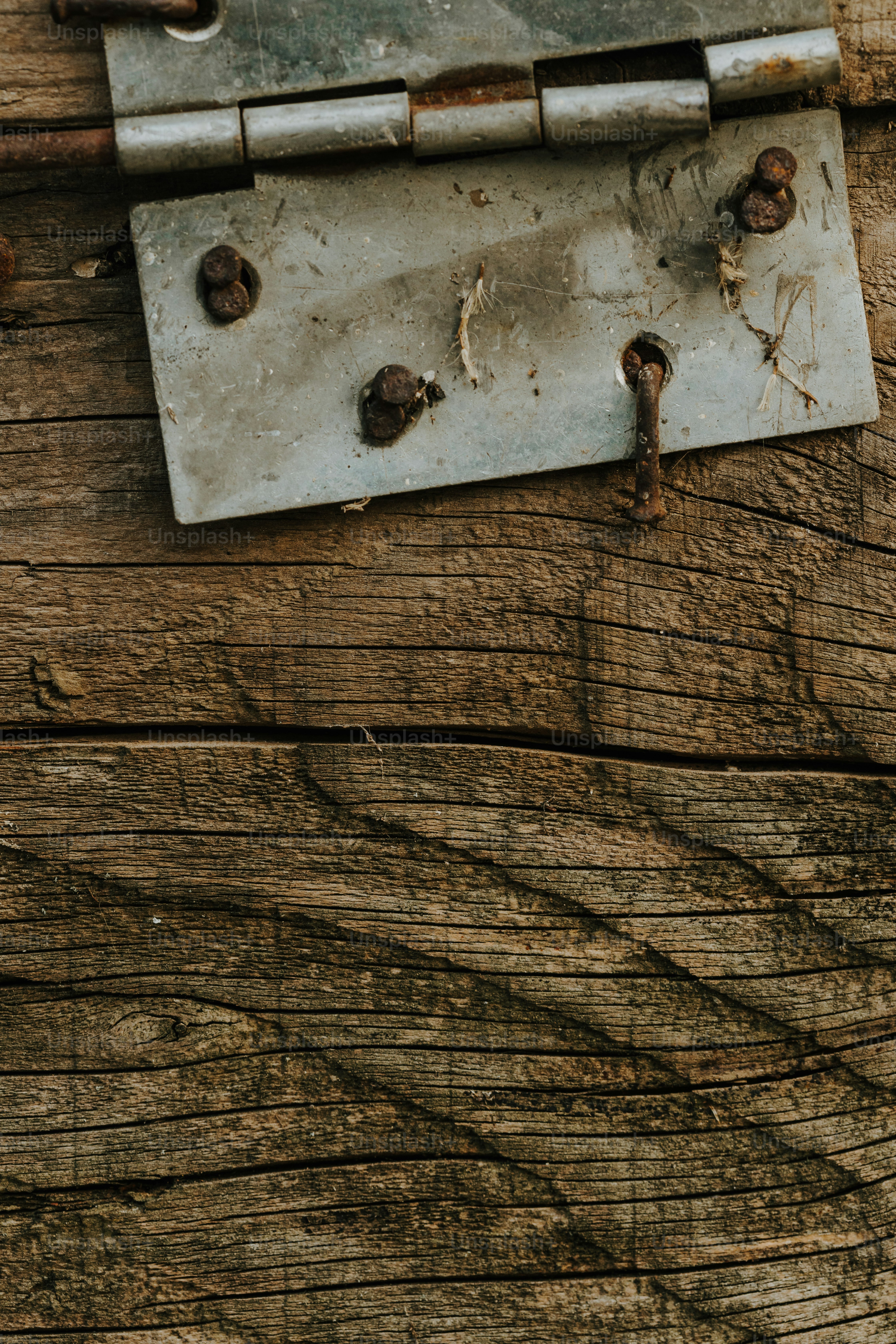 a close up of a lock on a wooden door