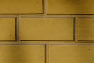 a close up of a yellow brick wall