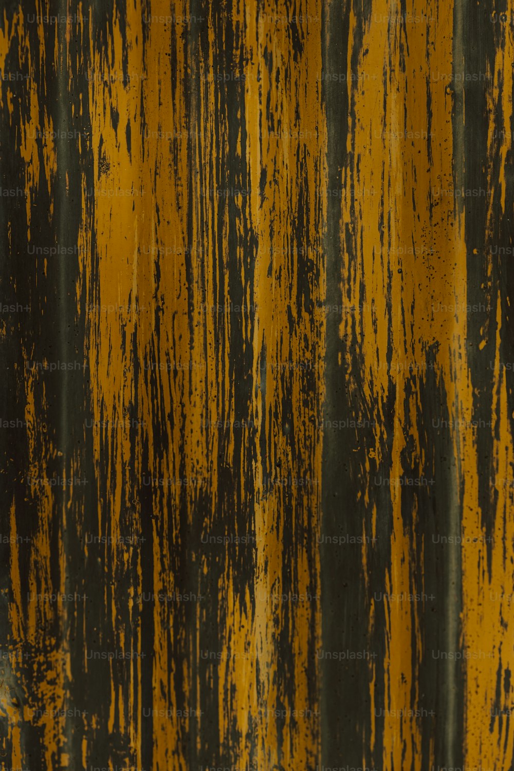 a close up of a yellow and black wall