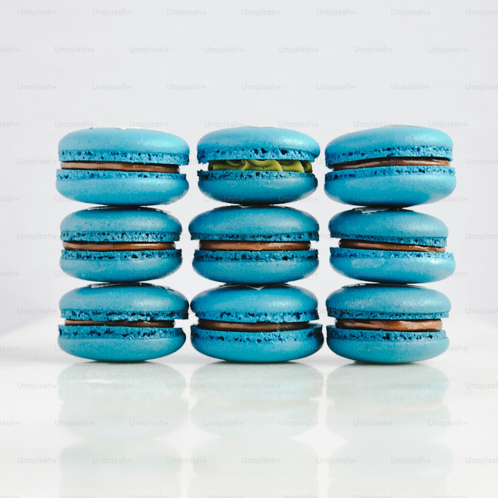 a stack of blue macaroons sitting on top of each other