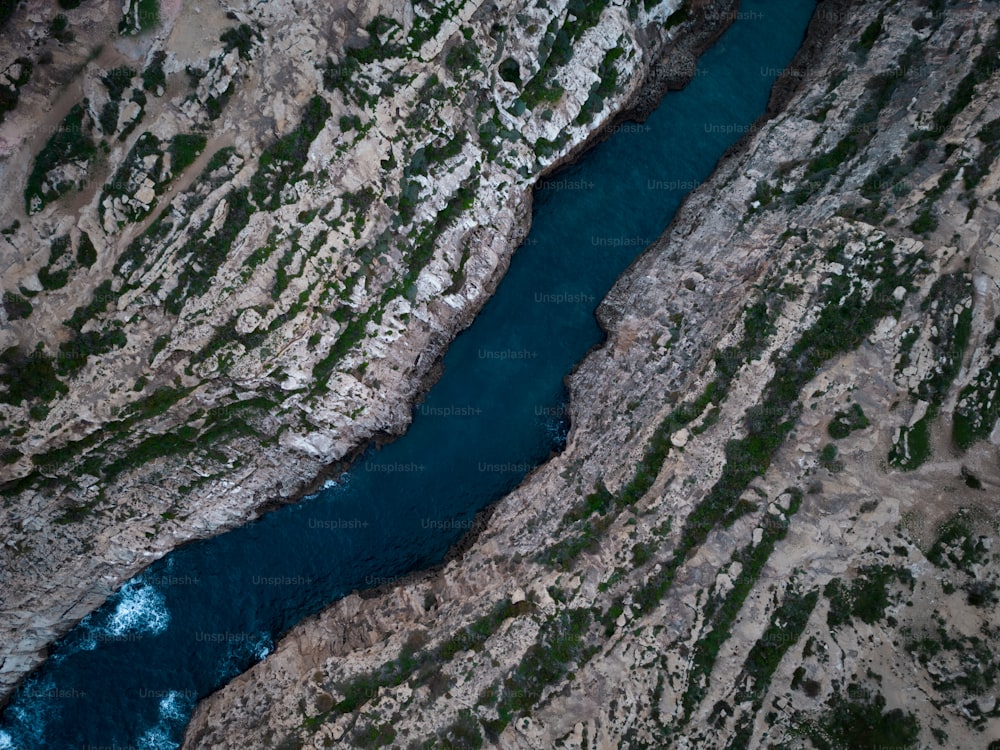 an aerial view of a river running through a canyon