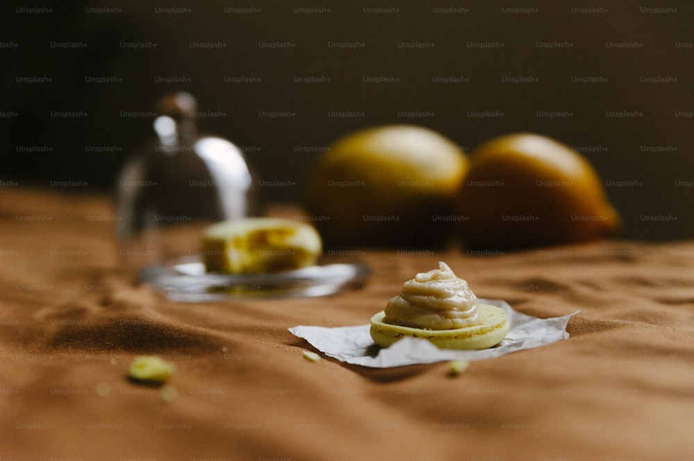 a table topped with oranges next to a wine glass