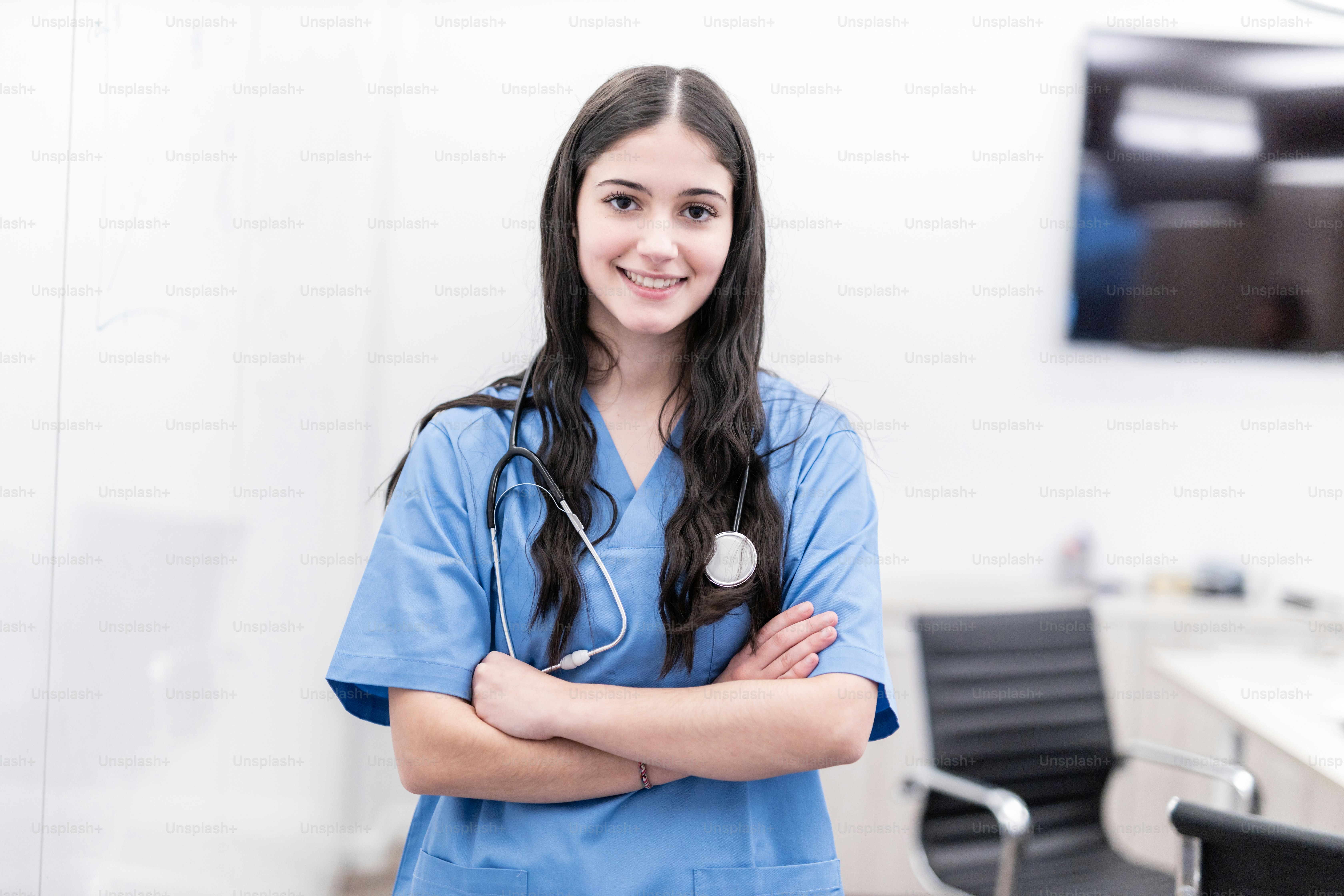 a woman with a stethoscope standing in a room