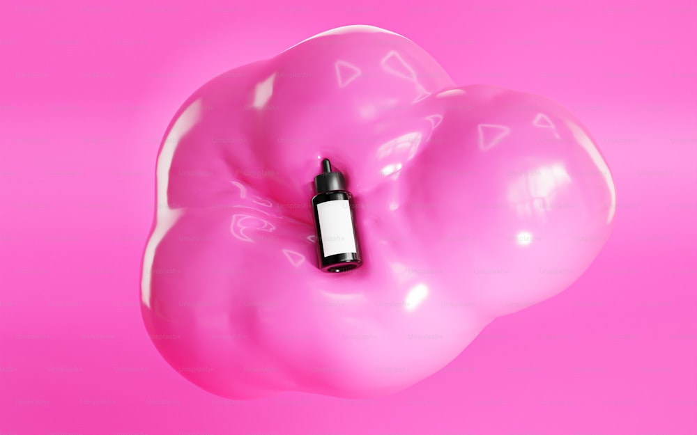 ein rosa Ballon mit einem schwarzen Marker, der herausragt