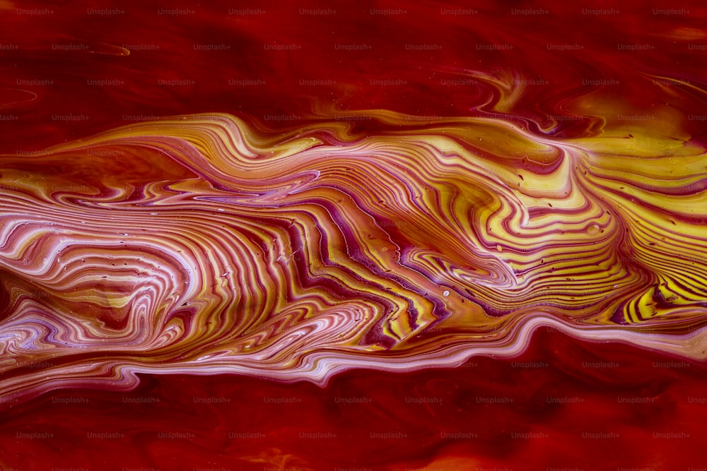 a red and yellow abstract painting with a red background