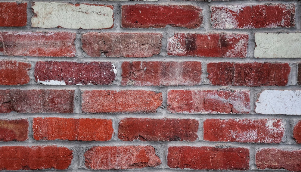 a close up of a red brick wall