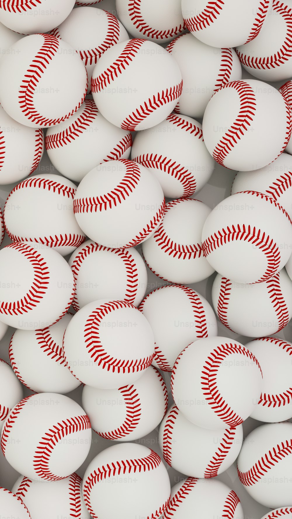 a bunch of baseballs that are white and red