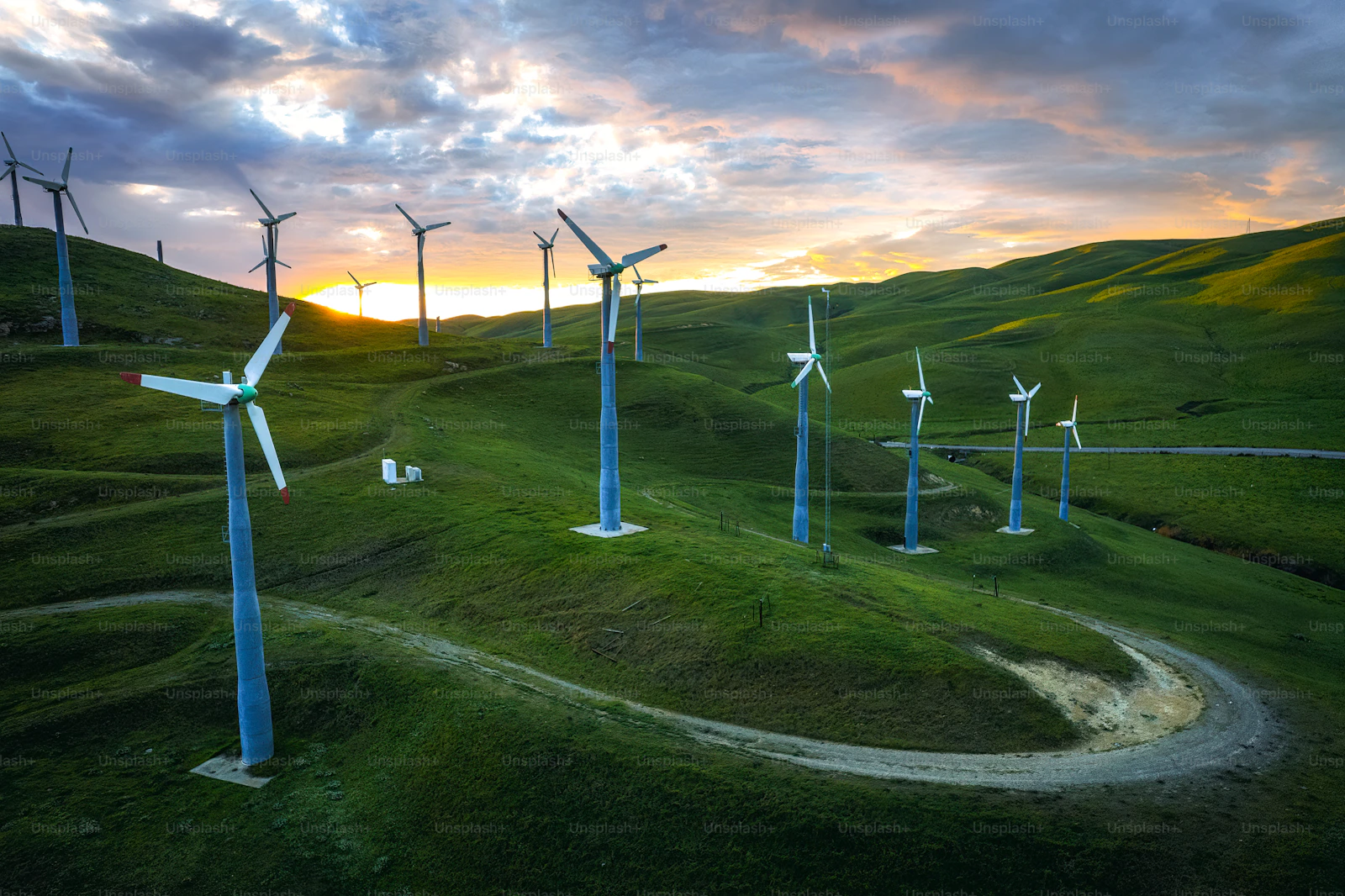 windmills in grass - renewable energy landscape