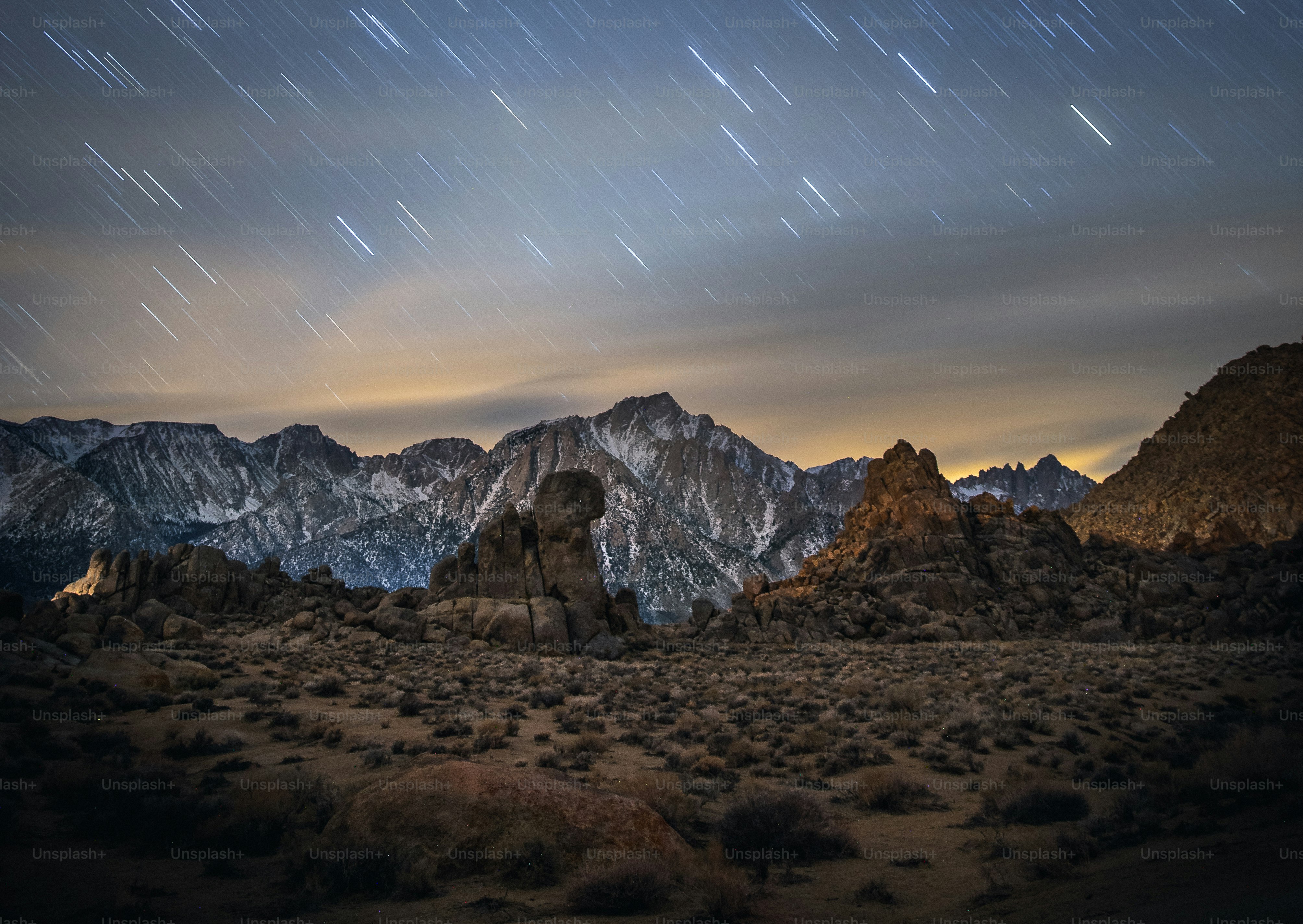 a mountain range with stars in the sky